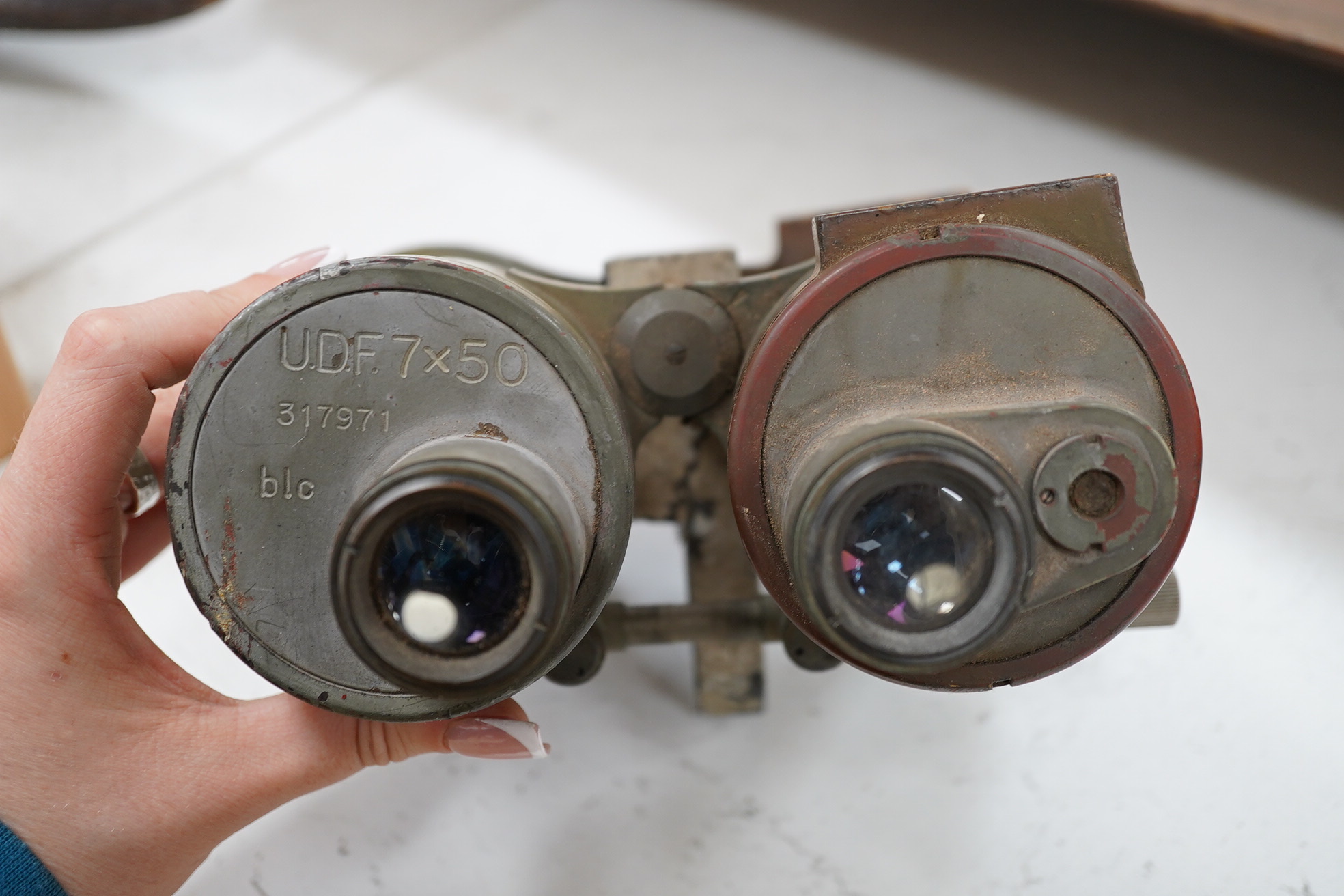 A pair of WWII German U boat coning tower binoculars stamped; U.D.F. 7x50 317971 blc, 20.5cm long. Condition - poor, all lenses damaged, one shattered, and general wear overall.